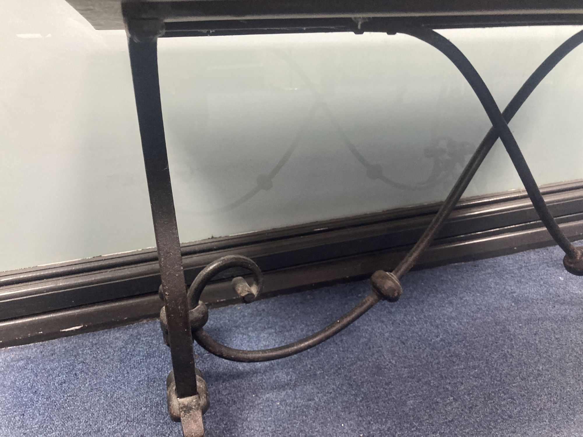 A rectangular reconstituted marble topped and wrought iron coffee table, width 94cm, depth 50cm, height 47cm